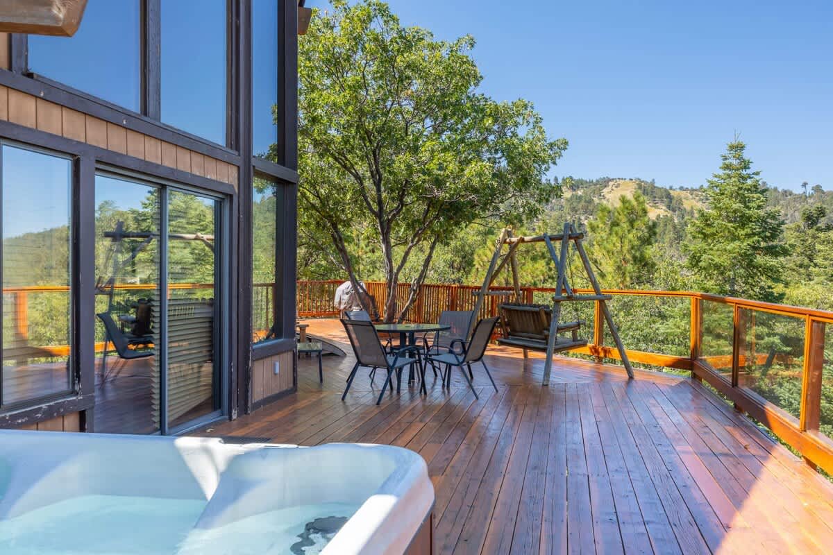 Hot tub steps from the deck dining