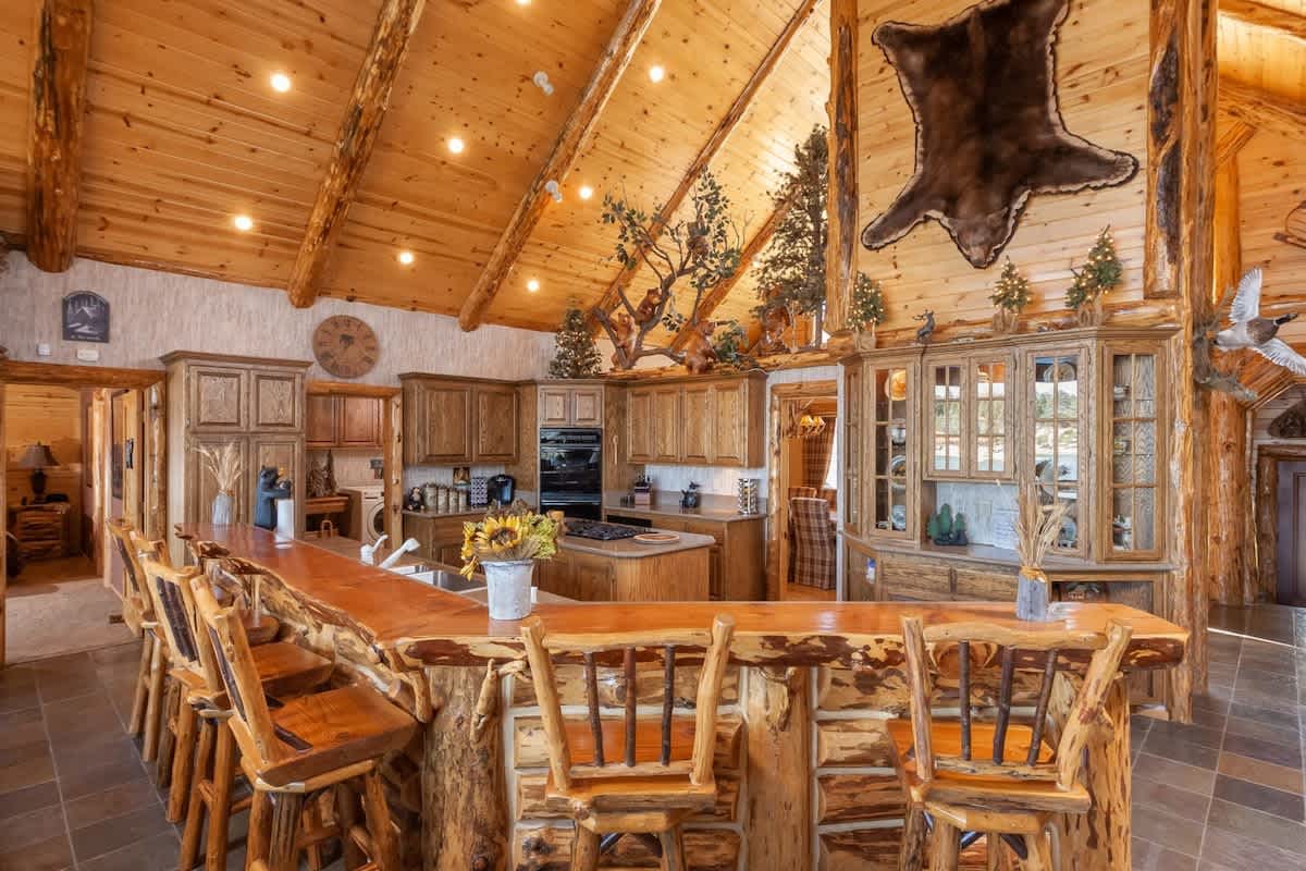 Long breakfast bar facing the granite kitchen