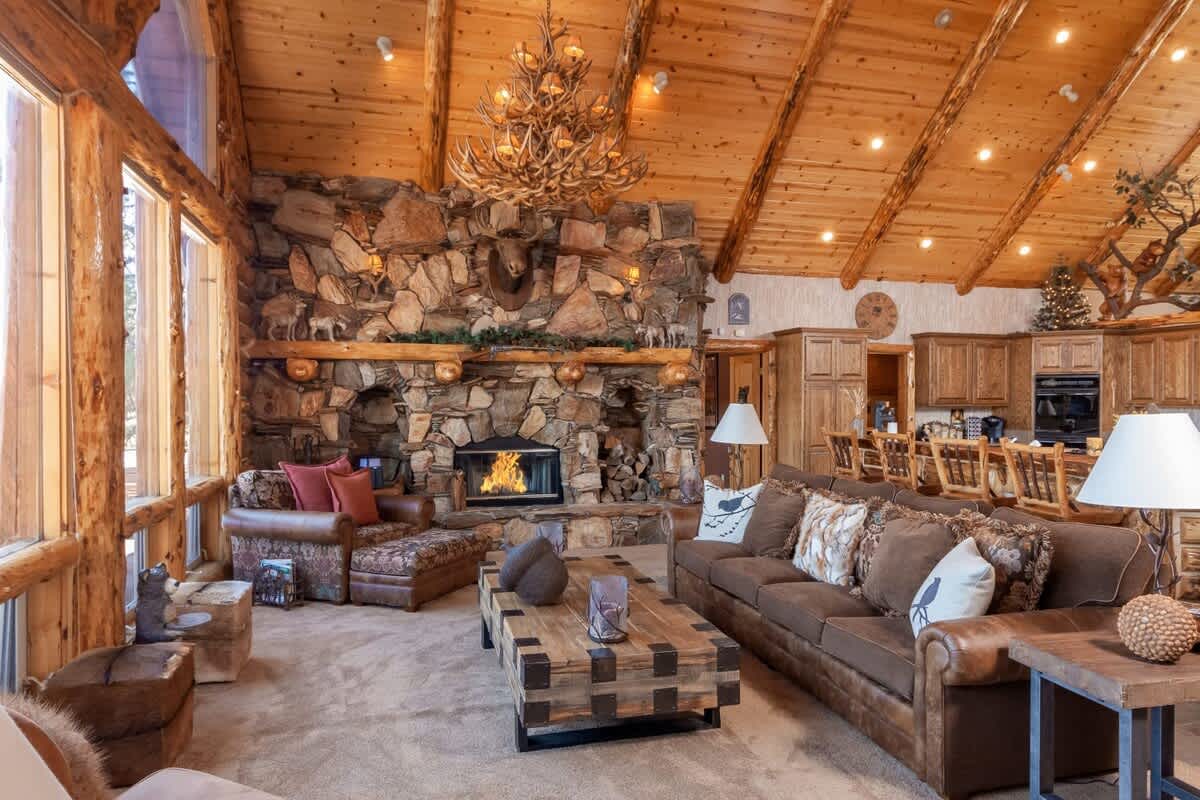 Towering log-beamed ceilings, open to the kitchen