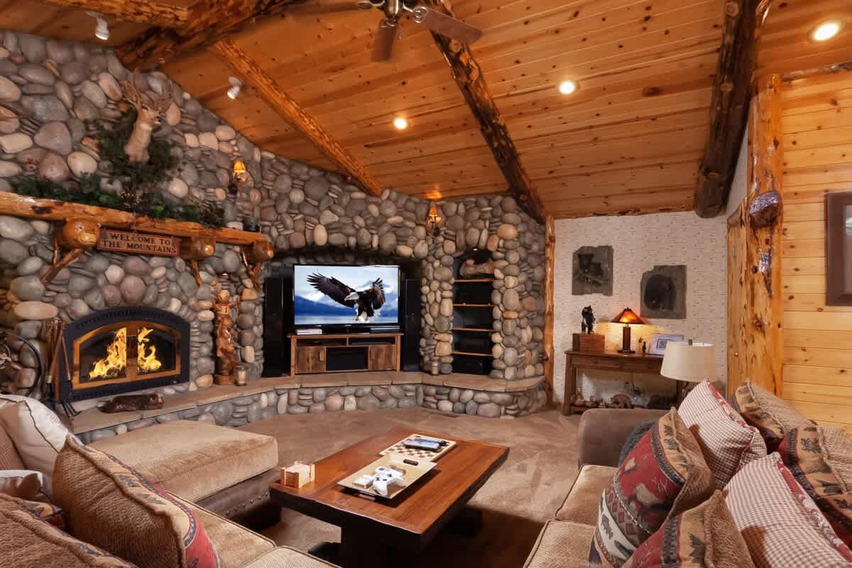 TV lounge with 60" Roku Smart TV and wood-burning fireplace