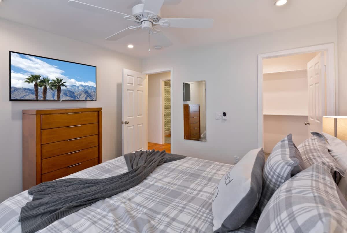 2nd bedroom with comfy Queen bed and huge Smart TV.