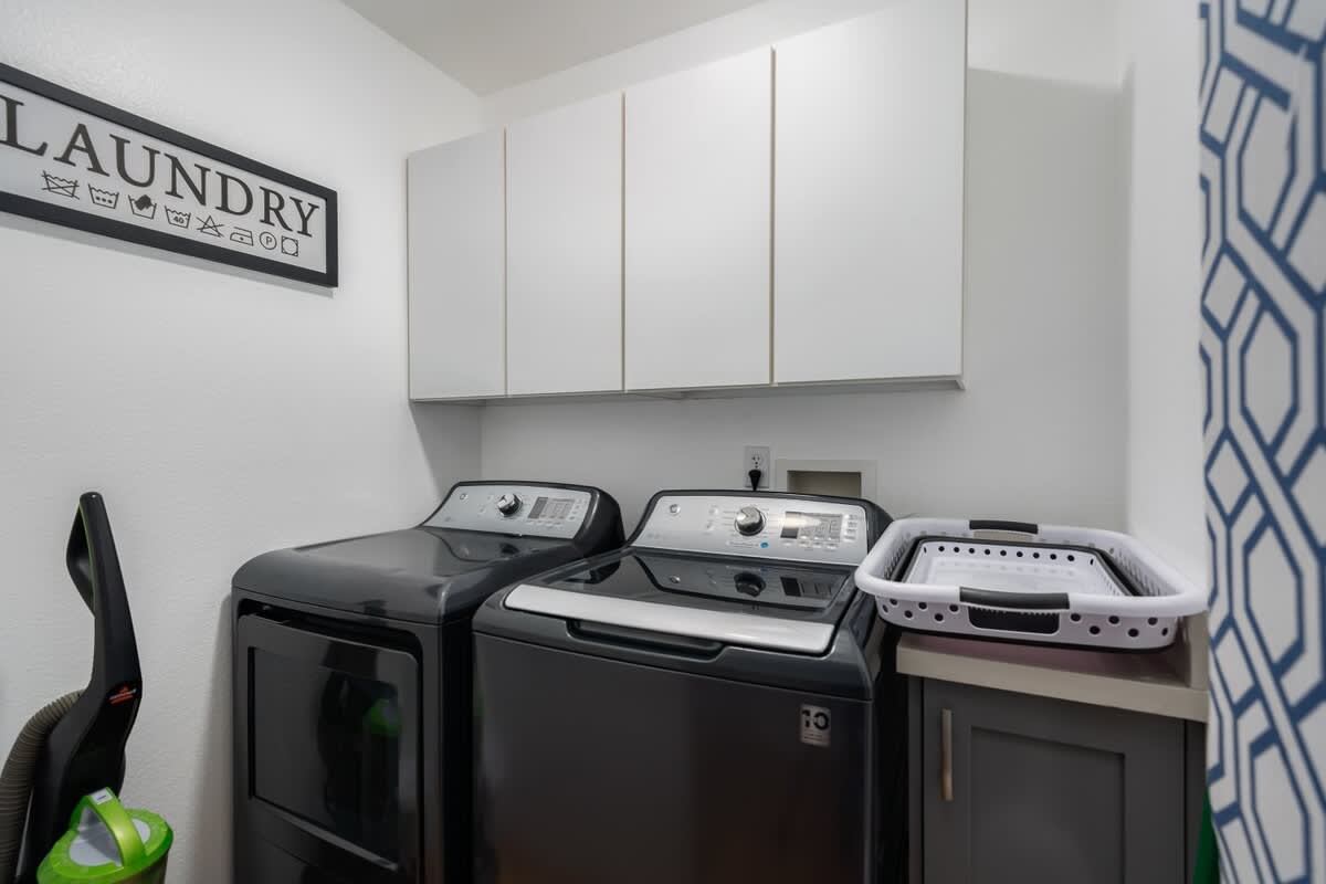 Convenient Laundry Room with new Washer and Dryer.