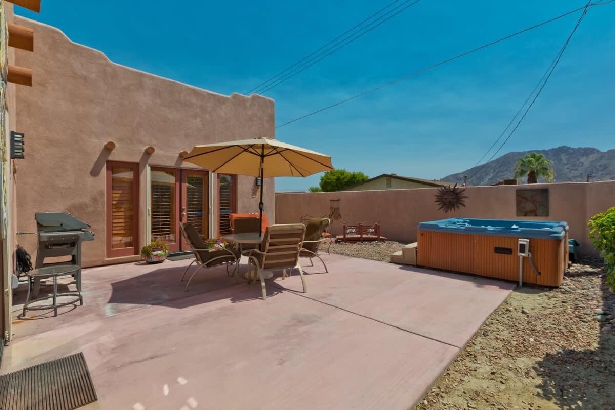 Private Backyard with Hot Tub, Weber BBQ and outdoor dining.