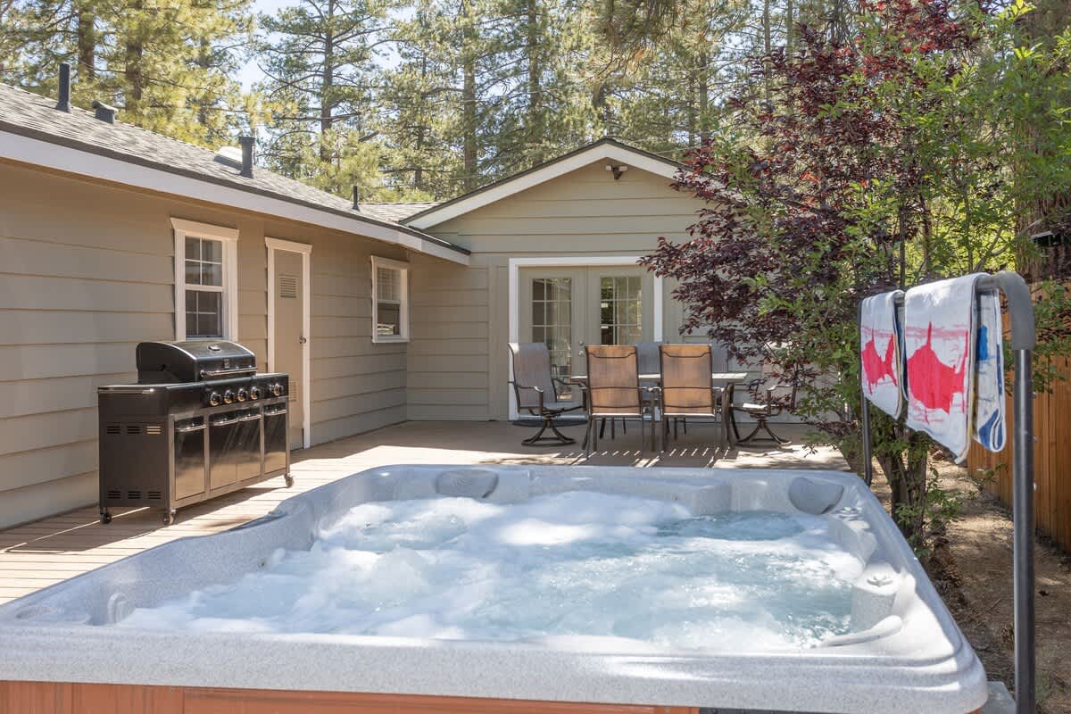 Private hot tub and propane BBQ on the backyard deck