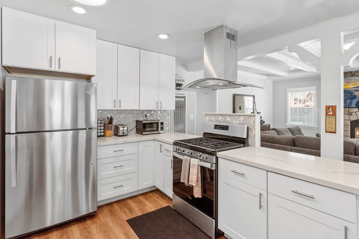 Kitchen with gas range and stainless fridge