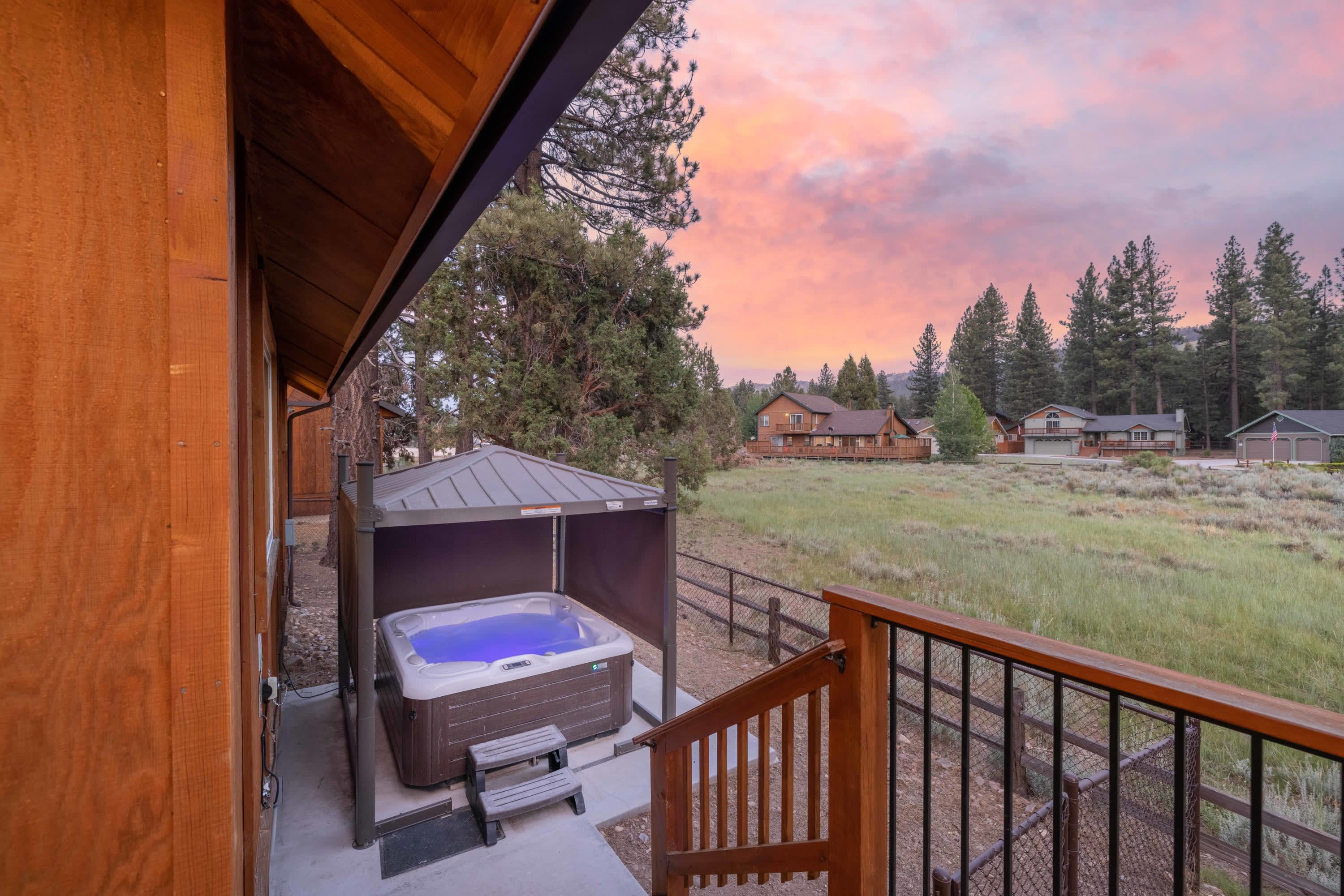 Hot tub at sunset with meadow views