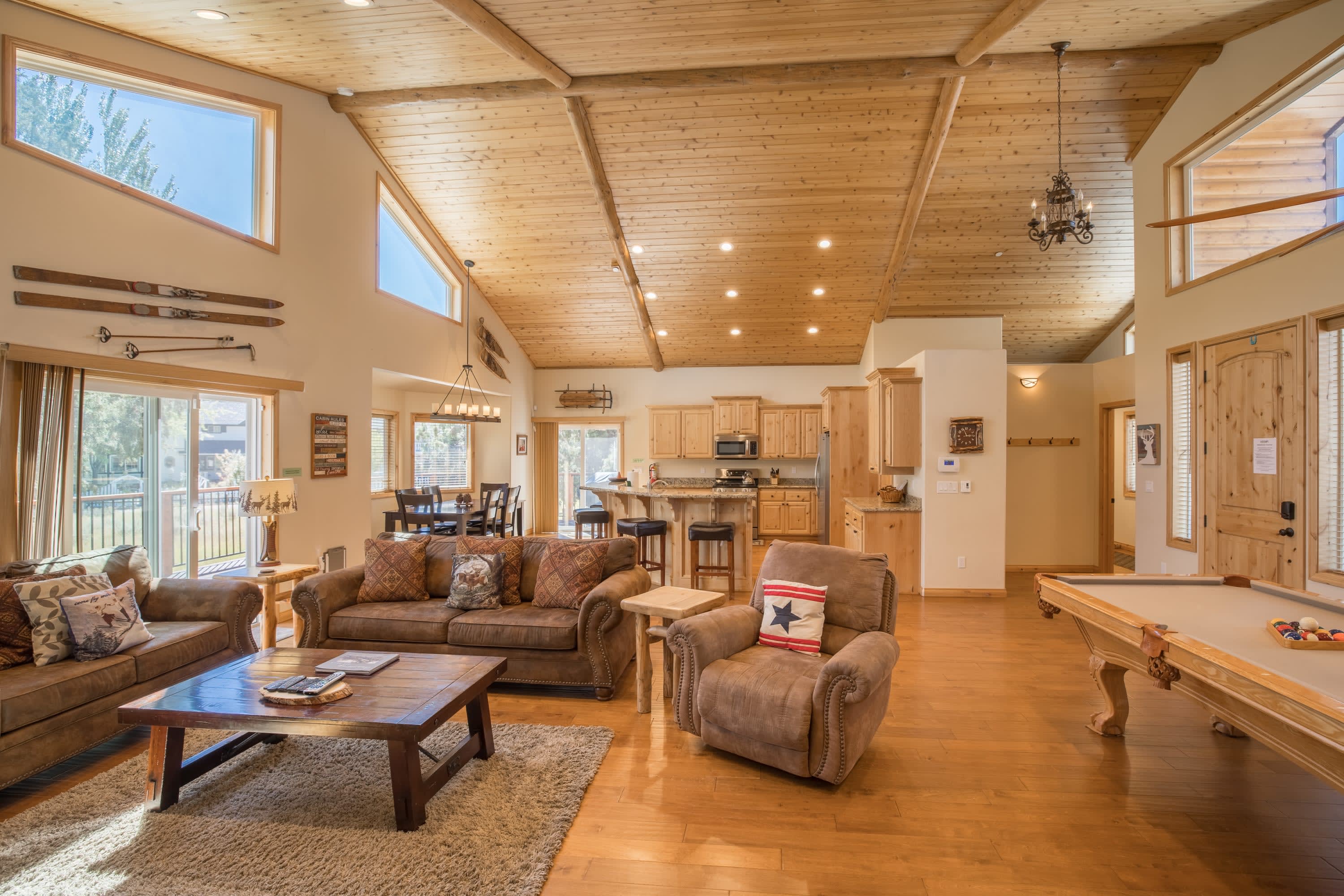Living room with leather sofas and pool table