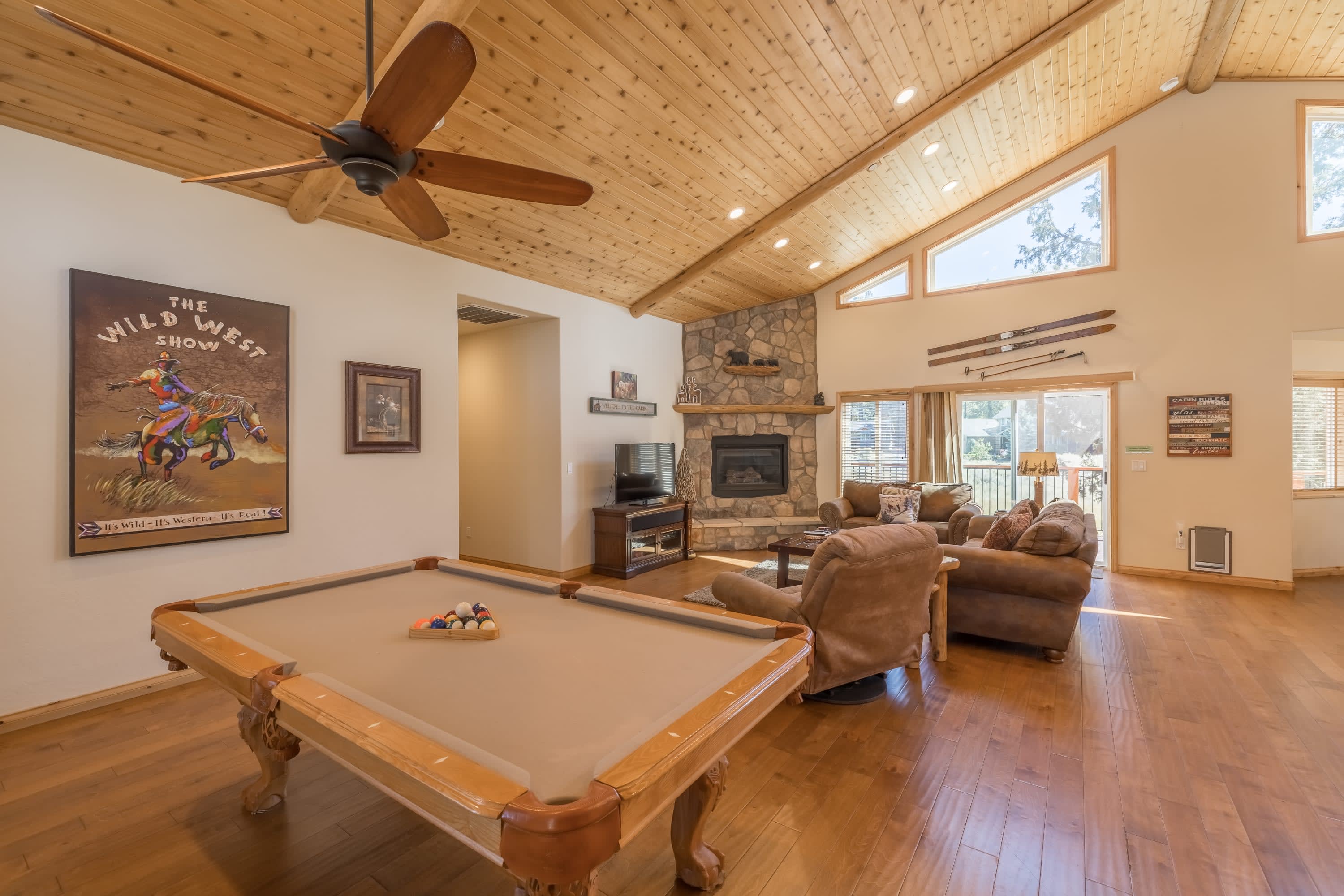 Pool table with the fireplace beyond