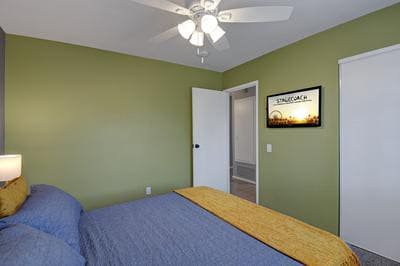 Bedroom with Queen bed and Smart TV.