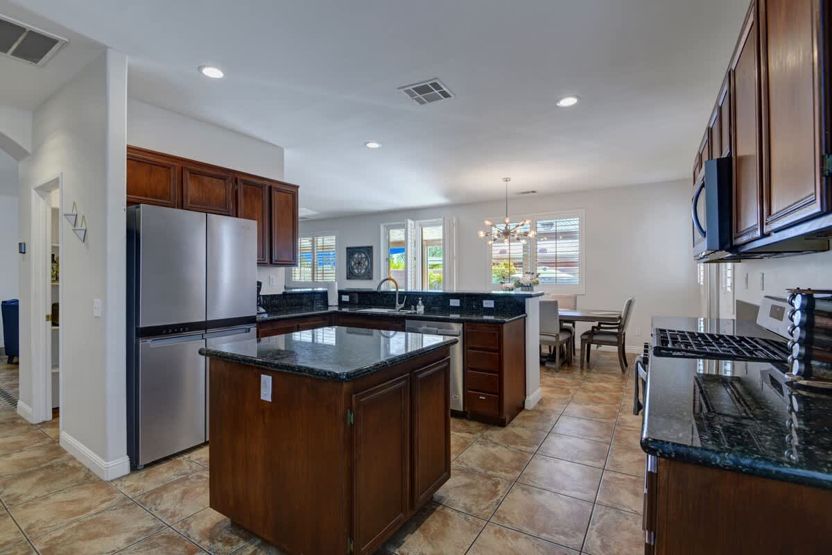 Open fully stocked kitchen with new Stainless steel appliances.
