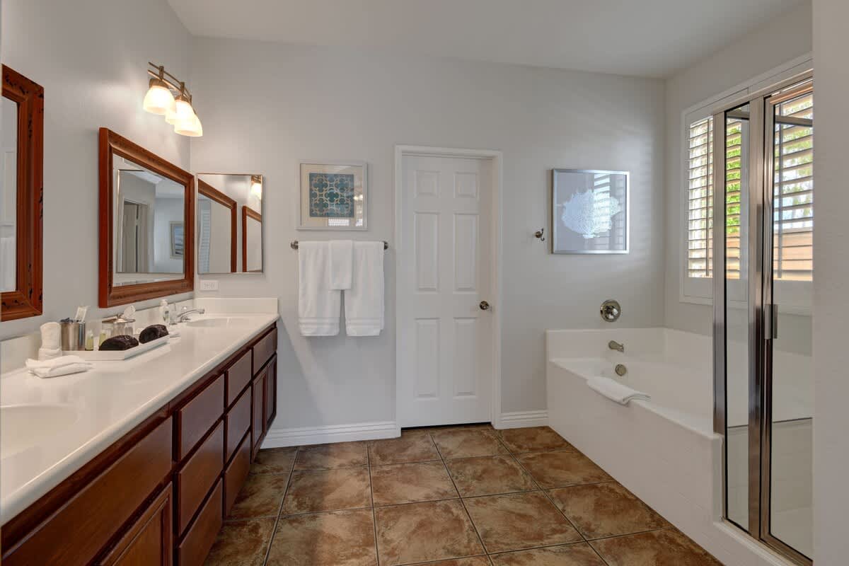 Master Bathroom featuring double sink and walk in closet.