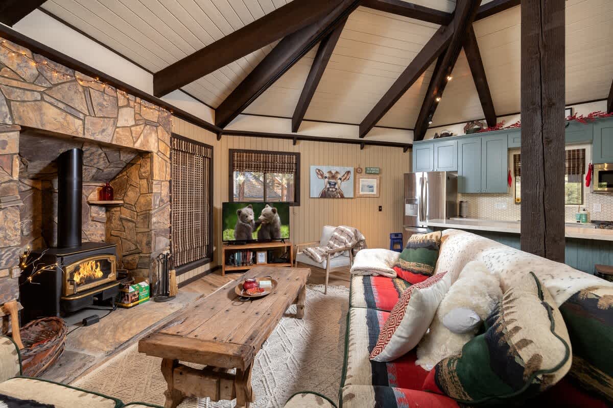 Soaring beamed ceilings and wood-burning fireplace