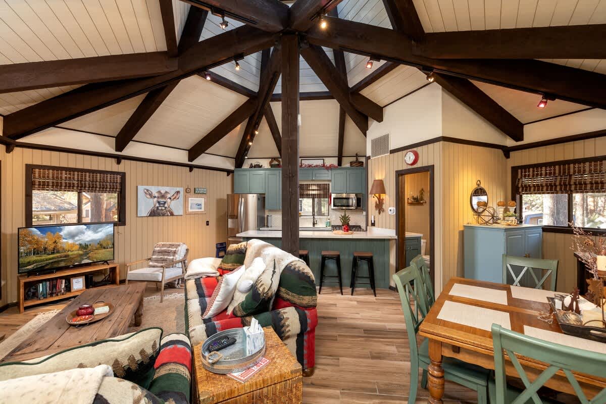Living room with Smart TV and kitchen views