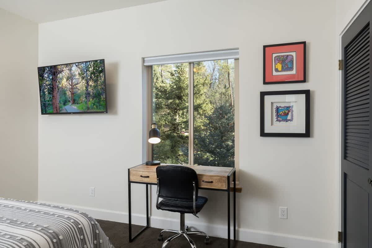 3rd bedroom upstairs with LCD TV and Desk.