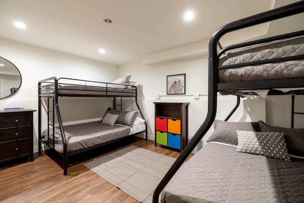 7th private bedroom in downstairs game room with a door.