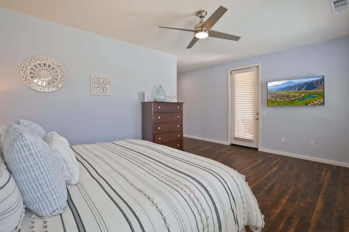 Master King Bedroom featuring ensuite bathroom and smart LCD TV