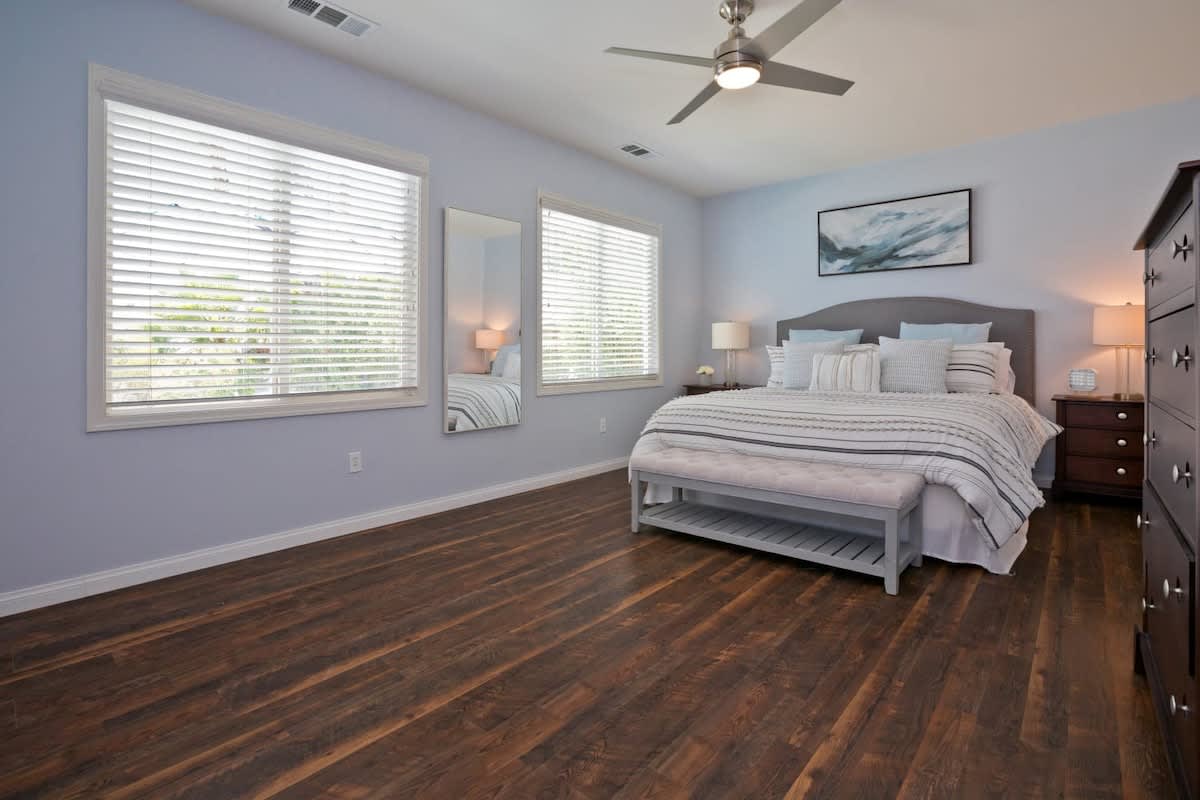 Master King Bedroom featuring ensuite bathroom and smart LCD TV