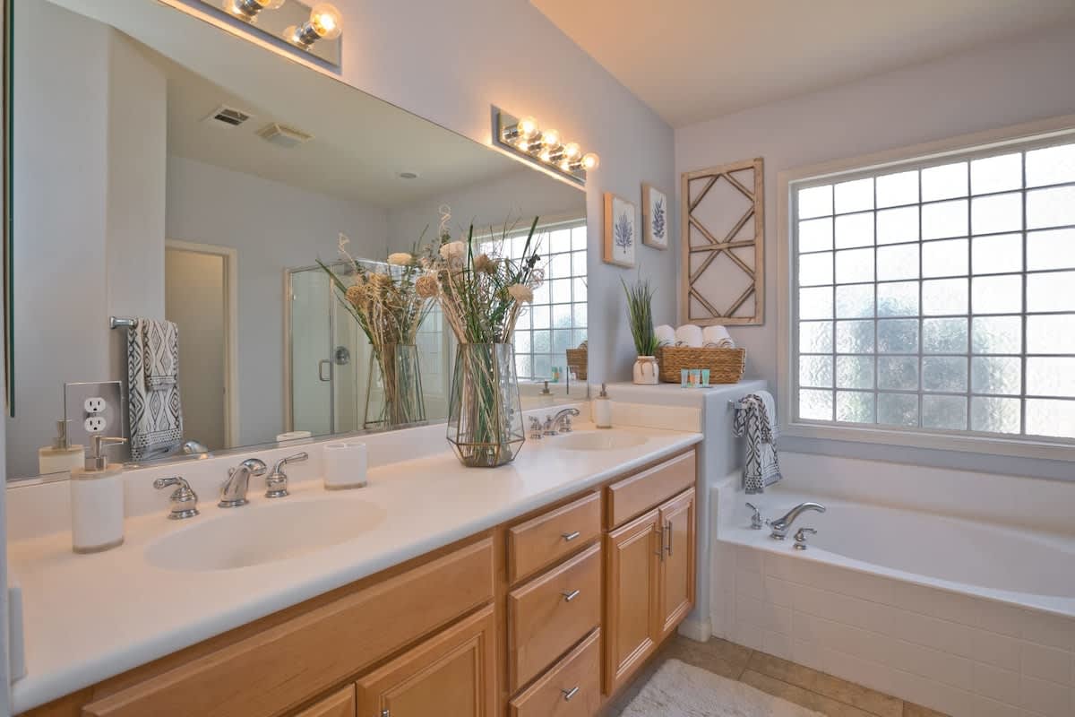 Master Bathroom with double sinks, Bathtub and separate shower.