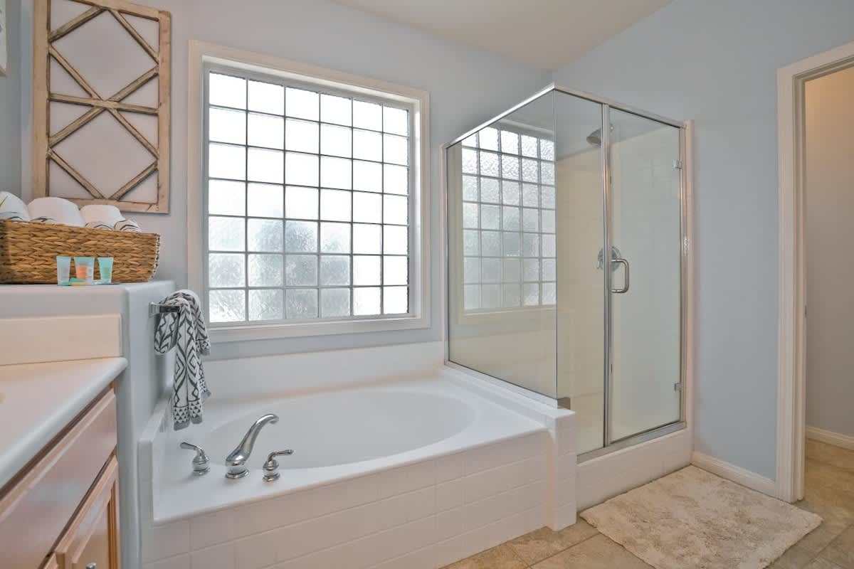 Separate Tub and Shower with private toilet.
