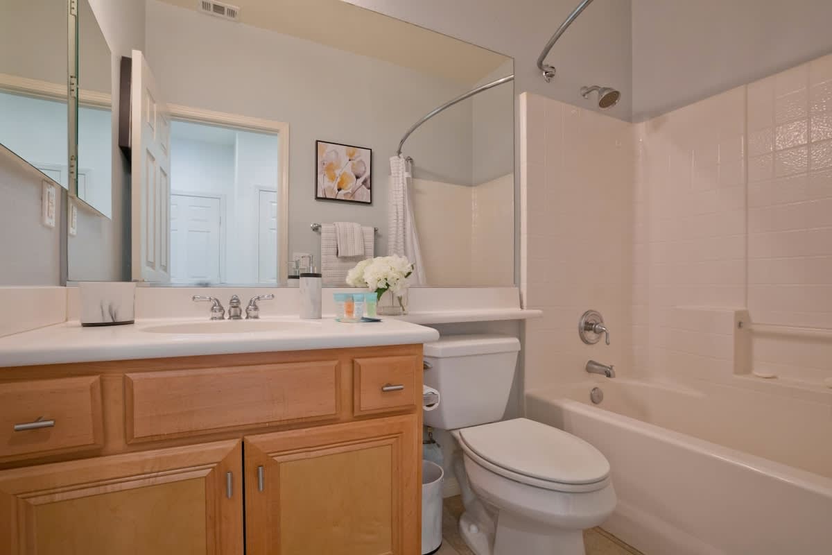Hall bathroom with tub/shower, next to the bunk room.