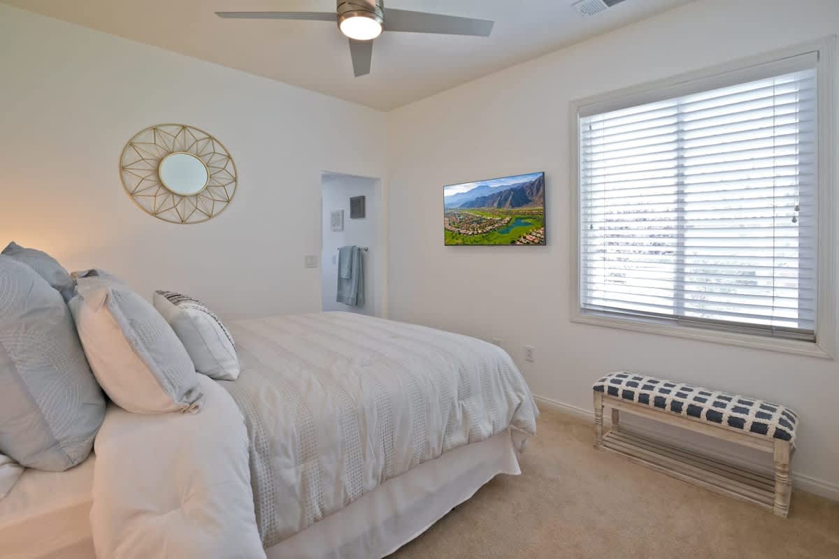 Queen bedroom with private bathroom and Smart TV.