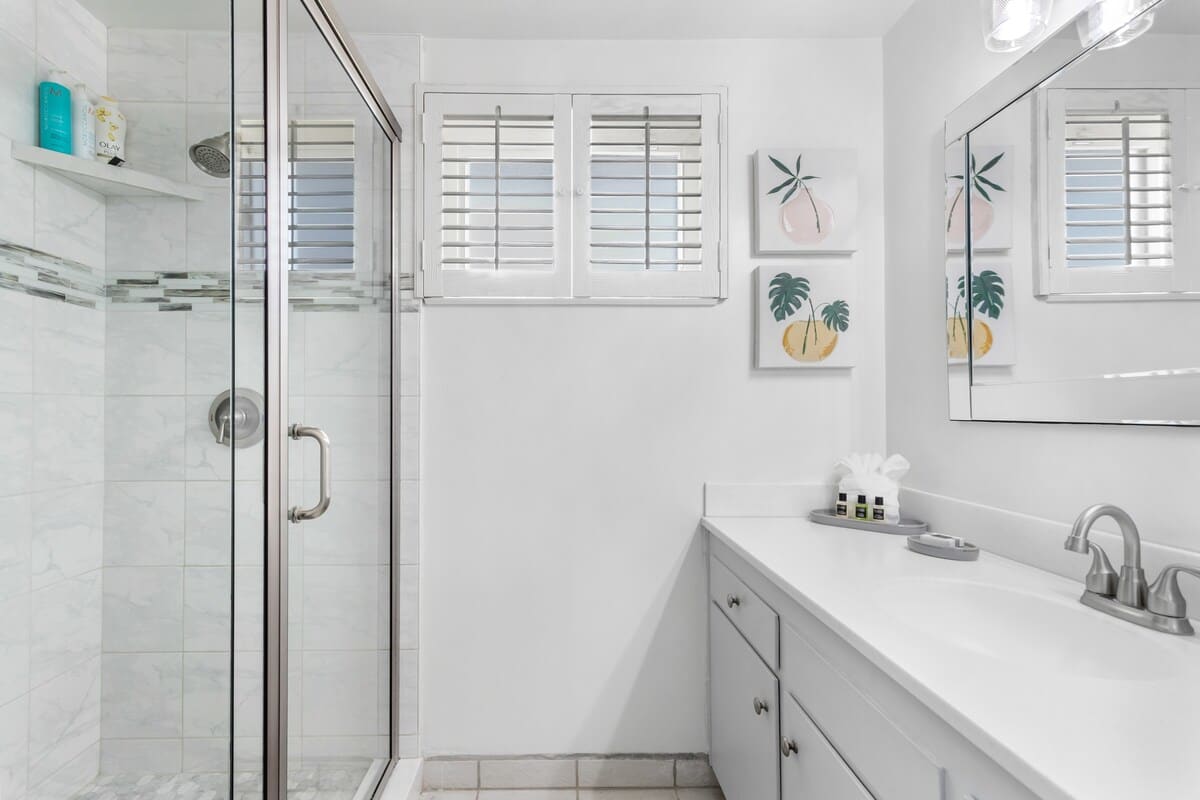 Sparkling clean master bathroom with tiled shower.
