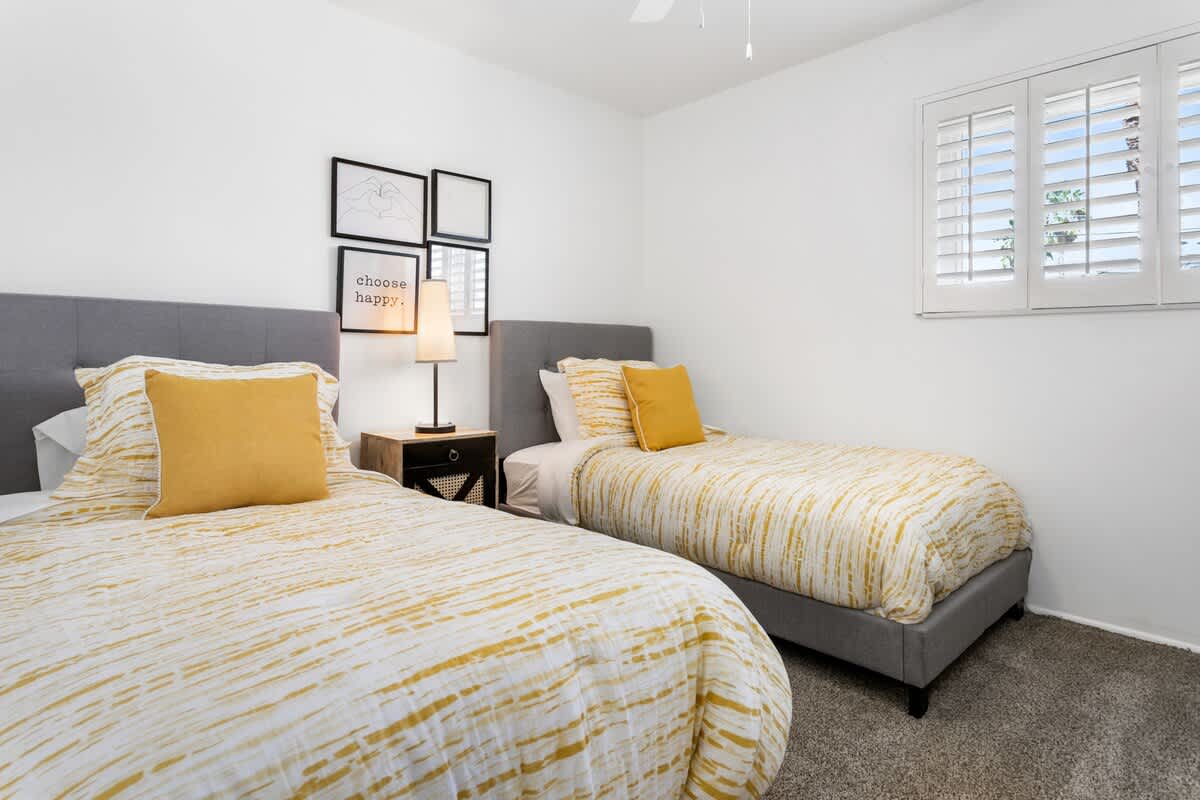 3rd fun and modern bedroom with 2 comfy twin beds.