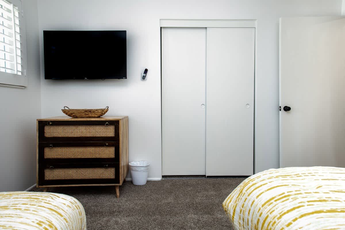3rd bedroom with 2 twin beds and Smart LCD TV.
