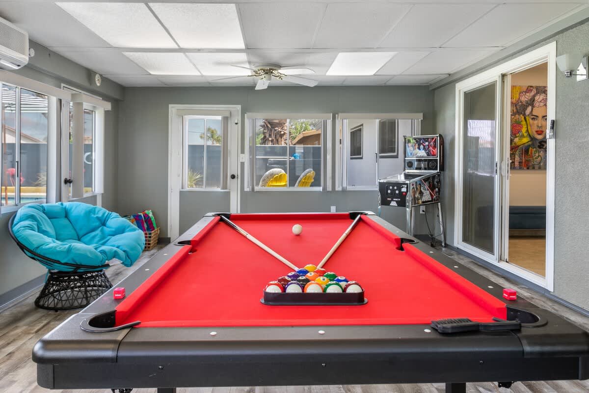 Pool Table, Star Wars Pinball Game, 65"TV, Miss Pacman video game.
