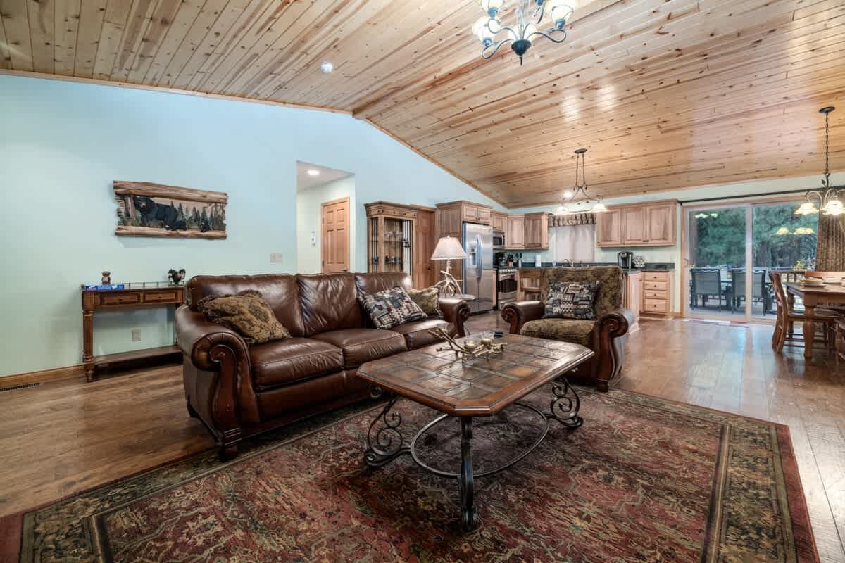 Open floor plan with high wood ceilings