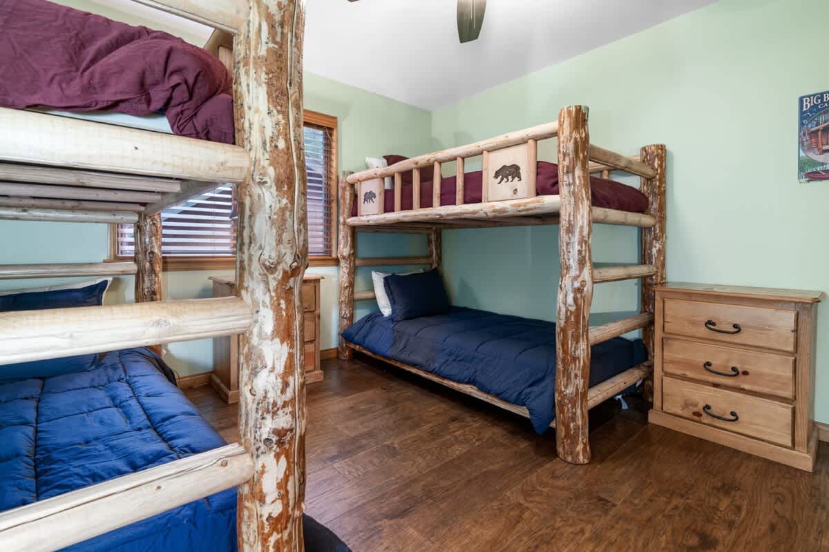 Bunk room with two sets of twin log bunks