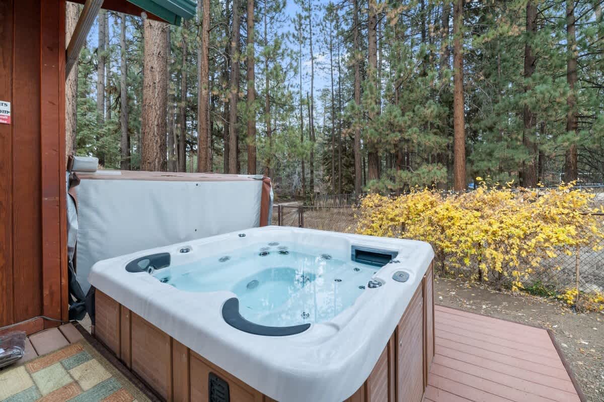 Private hot tub under the tall pines