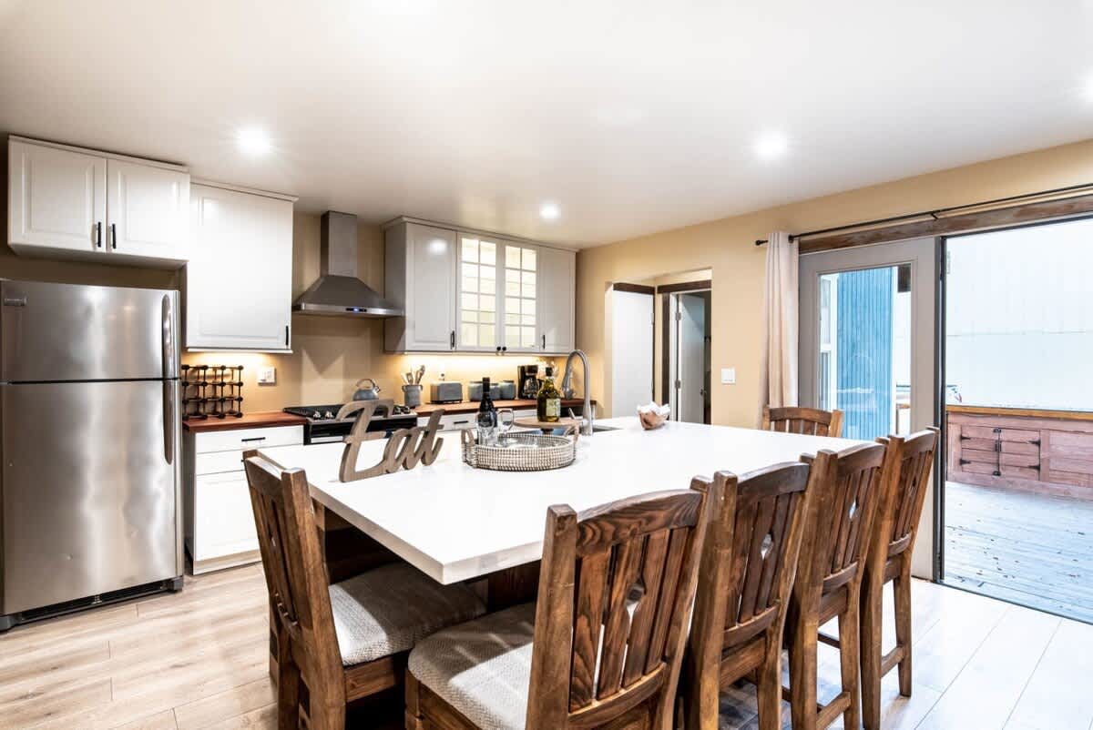 Kitchen with stainless appliances and deck access