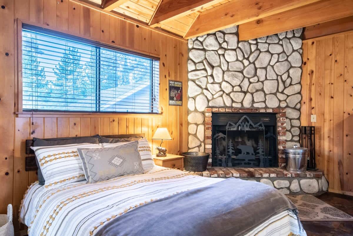 Bed by the wood-burning fireplace