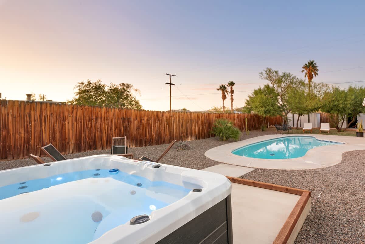 8-person LED hot tub next to the private pool.