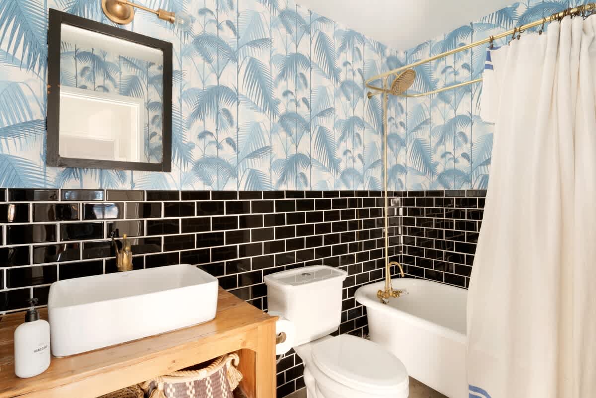 Hall bathroom with restored clawfoot tub.