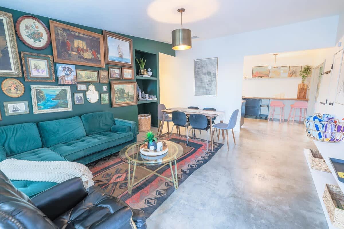 Colorful gallery wall and cozy living room.