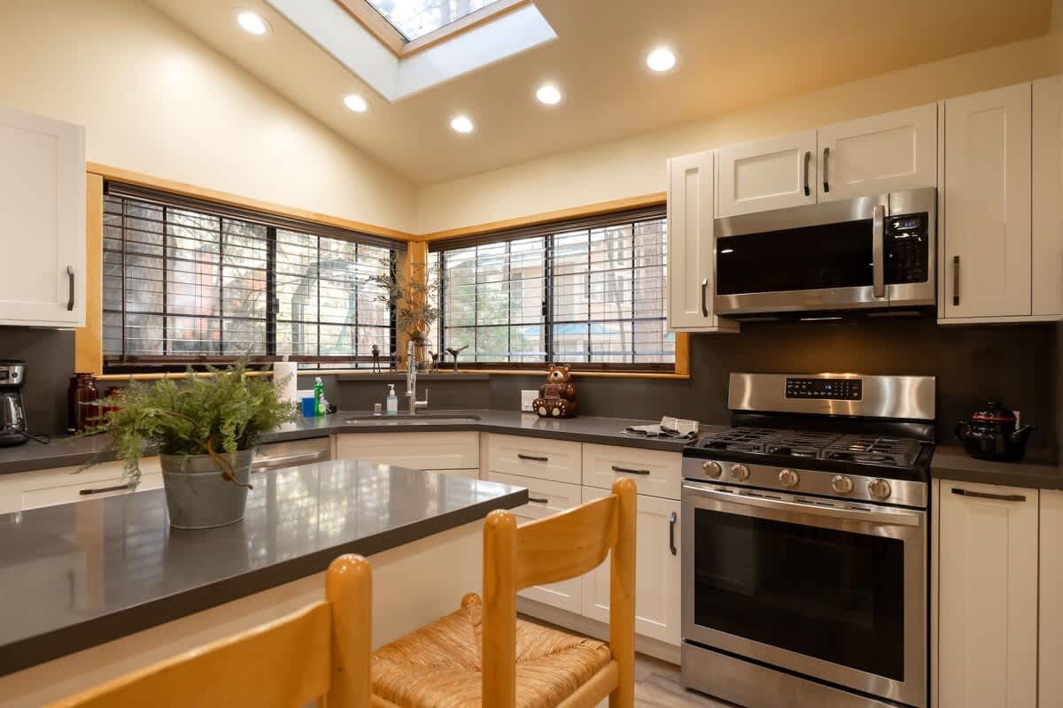 Kitchen with skylight and gas range