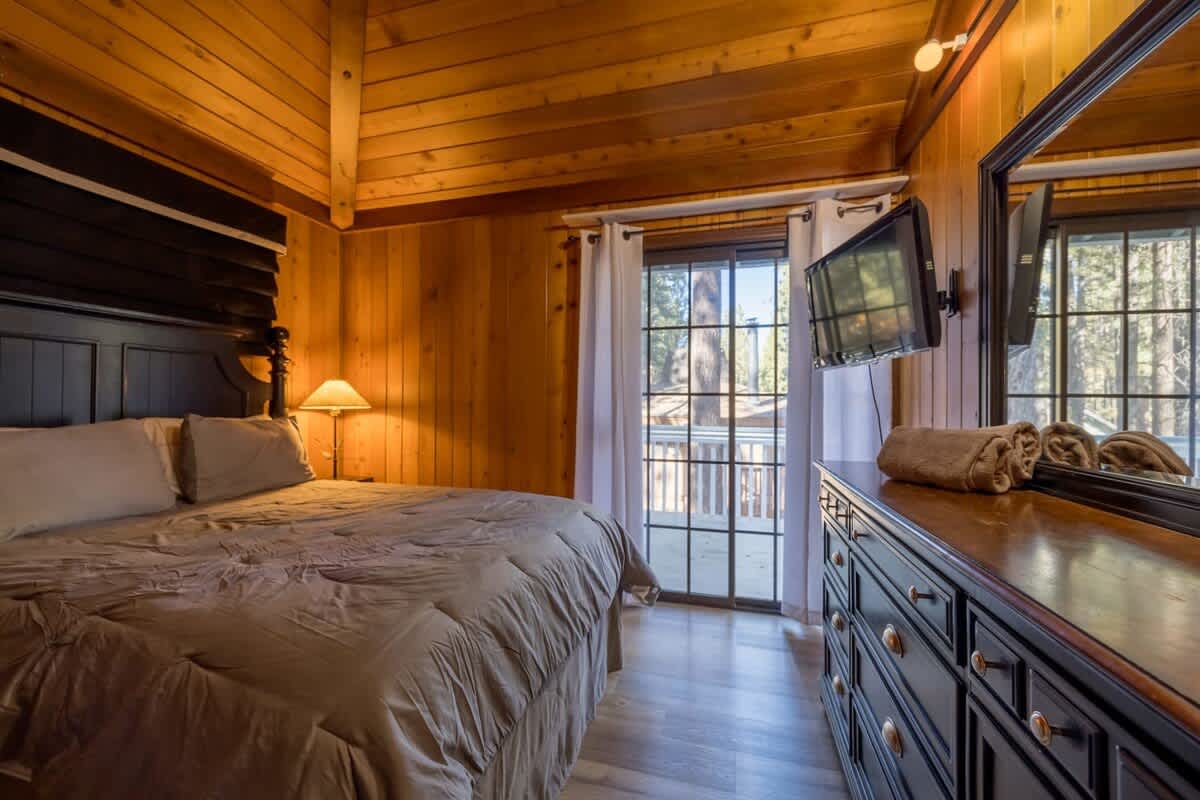 King bedroom with Smart TV and deck access