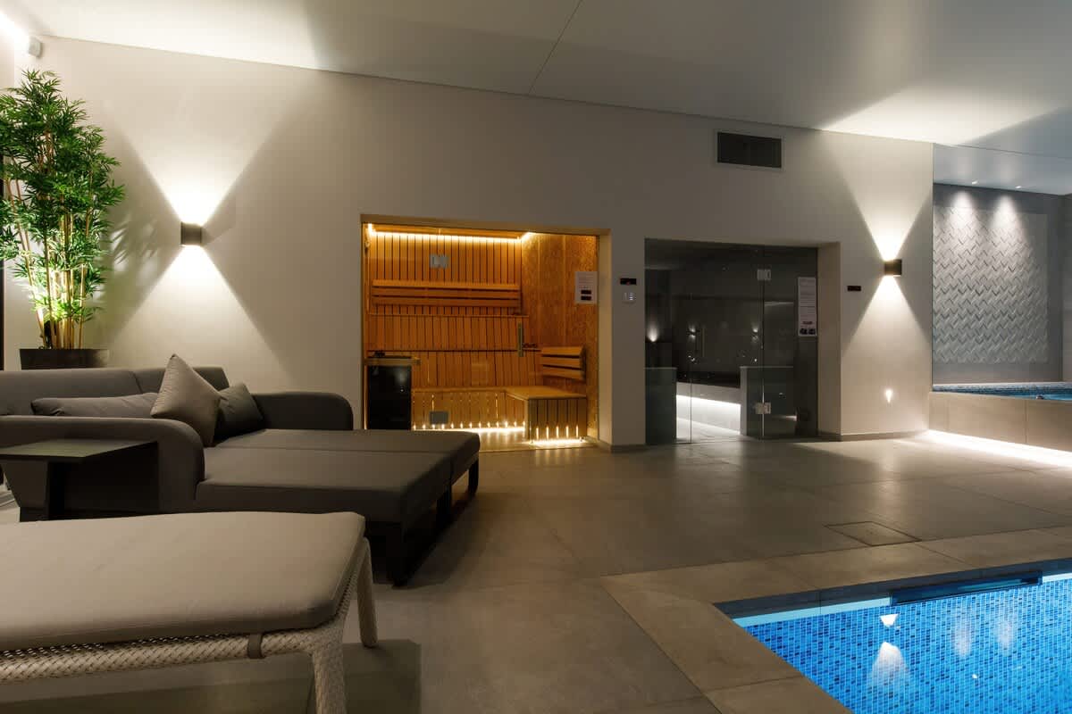 Experience the ultimate relaxation at The Cedars spa, featuring a luxurious sauna, steam room, and poolside lounge area. Perfect for unwinding in style. Spa access is available with extra charges.