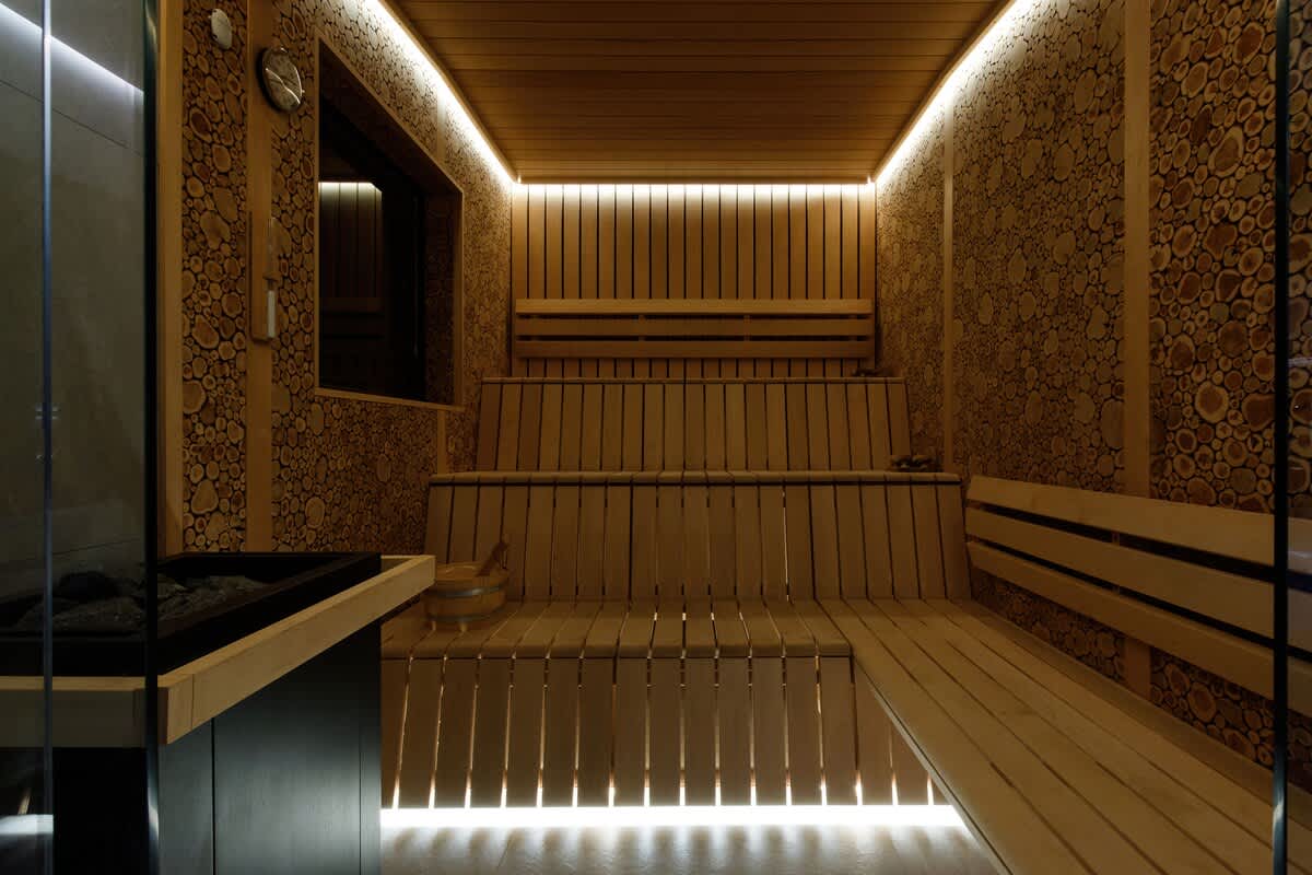 Relax in the warm ambiance of The Cedars beautifully designed sauna, featuring soft lighting and natural wood details. Perfect for unwinding after a long day. Sauna access is available for an additional charge