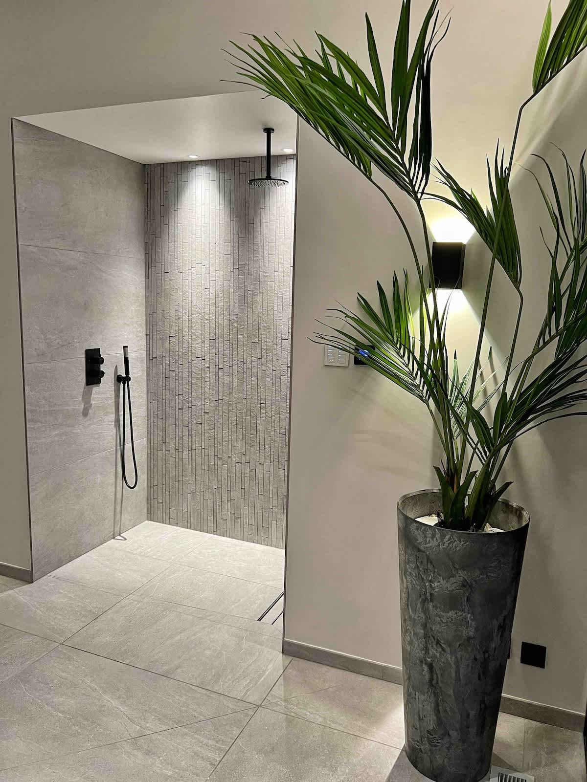 Experience the sleek and modern rain shower at The Cedars, perfect for refreshing after a swim or workout. Thoughtfully designed with premium finishes. Please note: extra charges apply for access to wellness and pool facilities