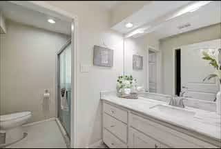 Modern bathroom with large mirror