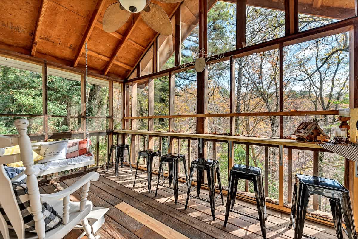This fully screened in deck allows you to enjoy the natural surrounding, without any of the creatures buzzing around in it. It also features a 16’ long bar for additional seating/ entertainment space.
