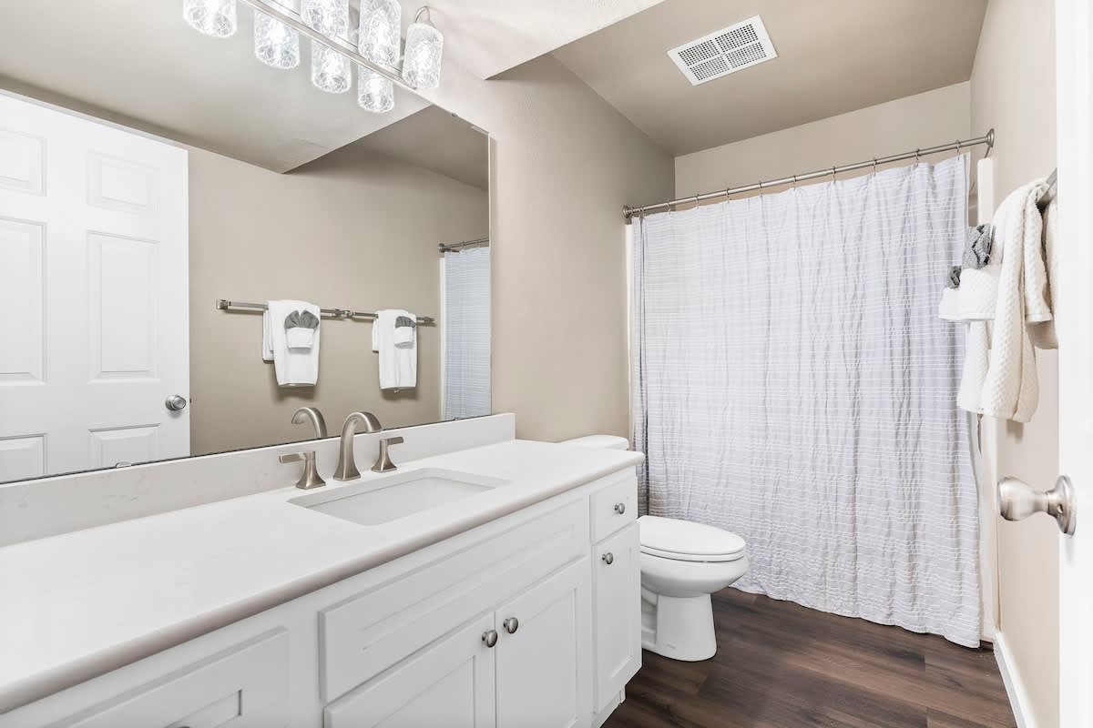 Guest bathroom with quartz countertops.