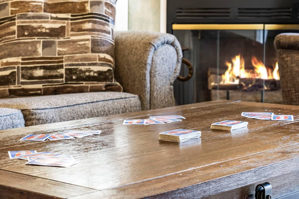 Family room with fireplace and board games.