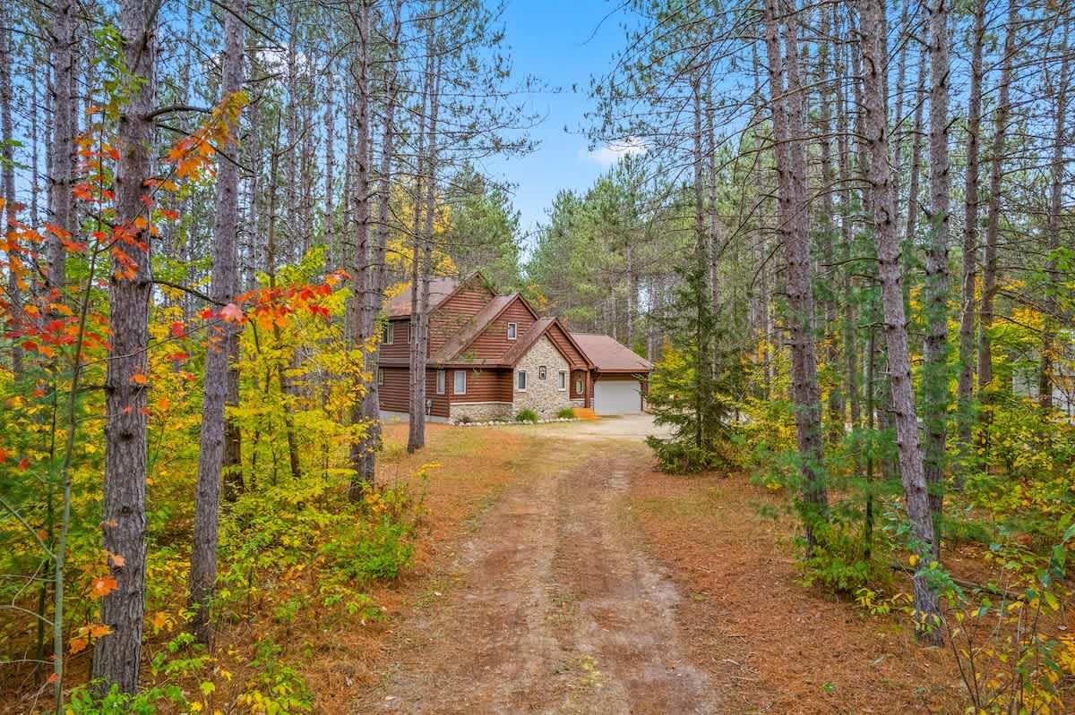 Secluded Cabin | Direct Trail Access • Fire pit — Mancelona, MI — vacation rental