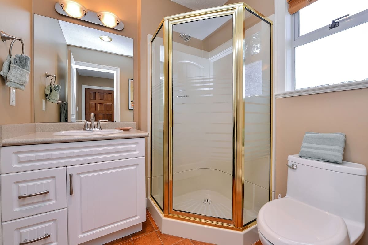 Main level bathroom with walk in shower. 