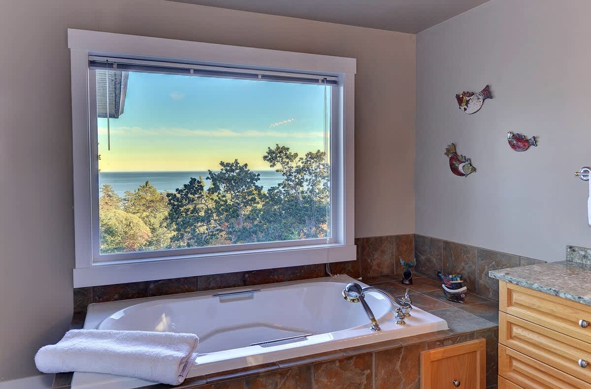 A large tub with views to soak up the view. 