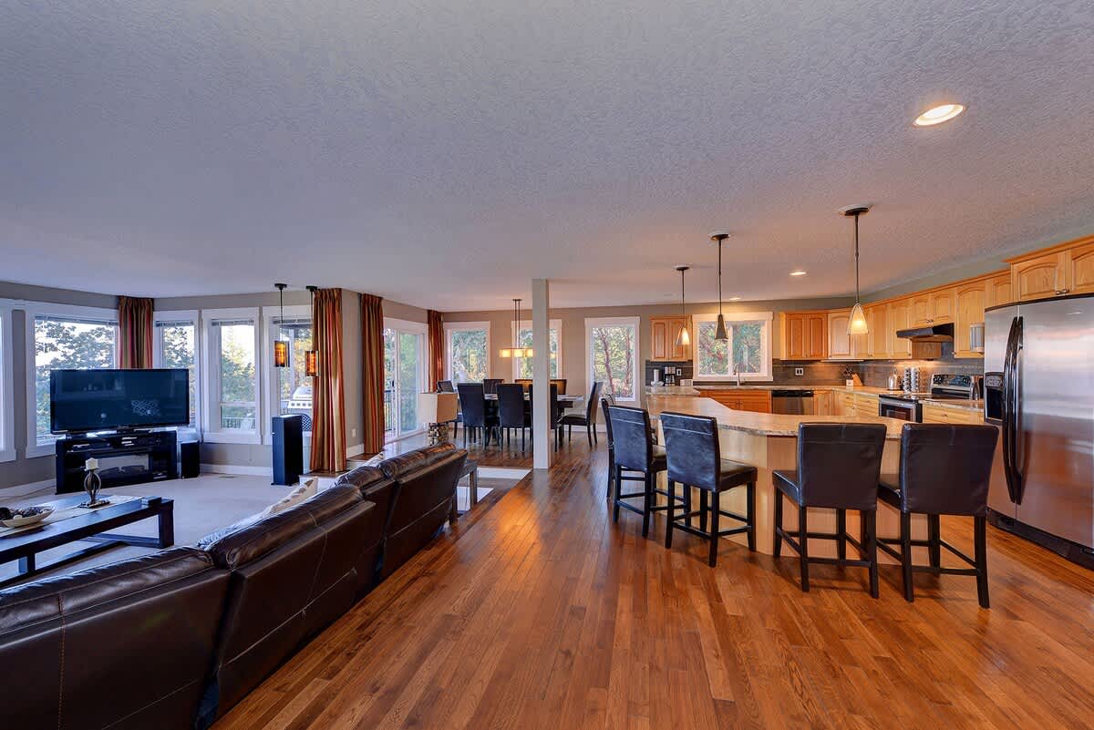Open concept formal living room, dining area and kitchen.